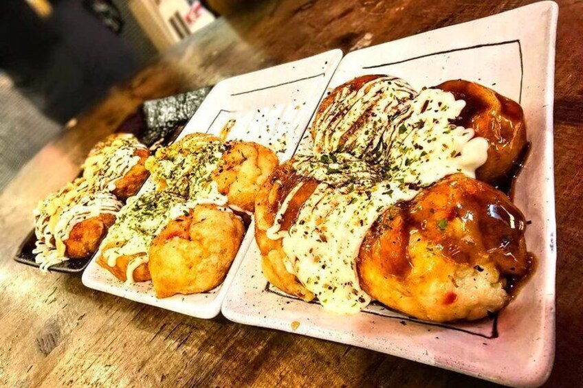 A plate of food with various toppings and sauces. 2