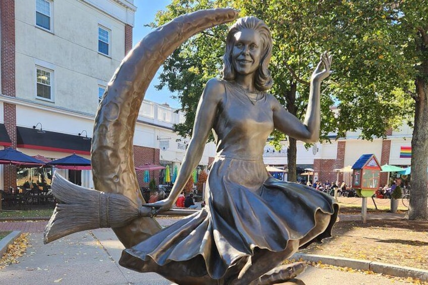 A statue of a woman riding a fish. 2