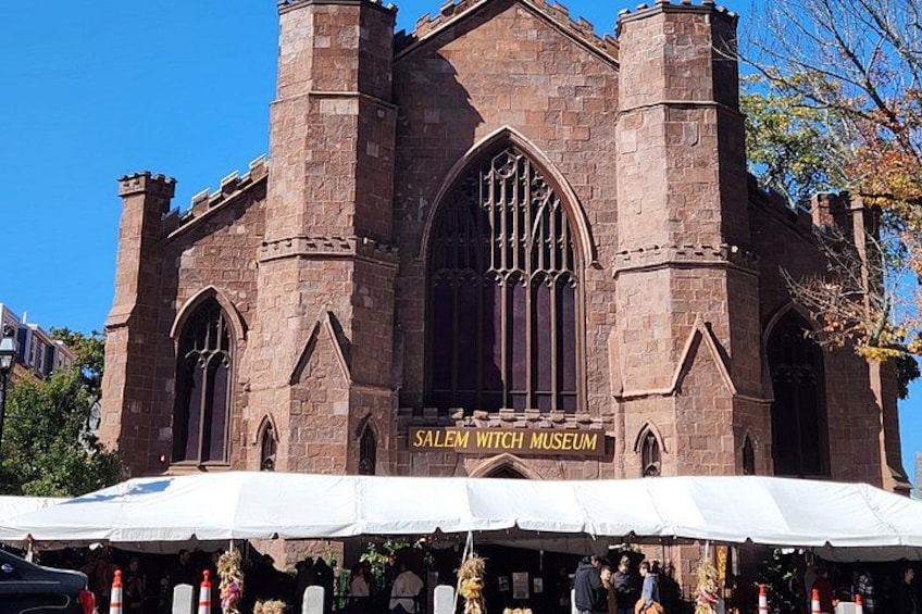 A historic building with a sign reading 'Salem Witch Museum.' 1