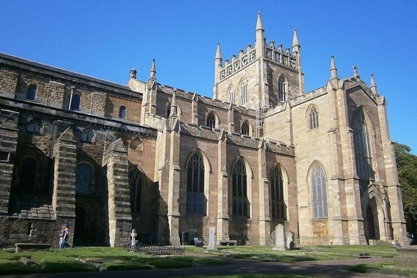 A historic church with arched windows and a prominent tower. 3