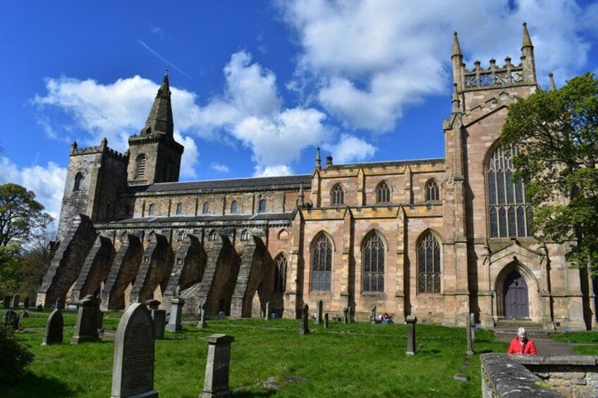 A historic church with a prominent tower and arched windows. 4