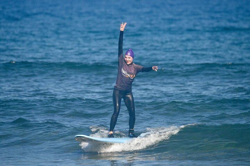A person surfing on a wave in the ocean. 3