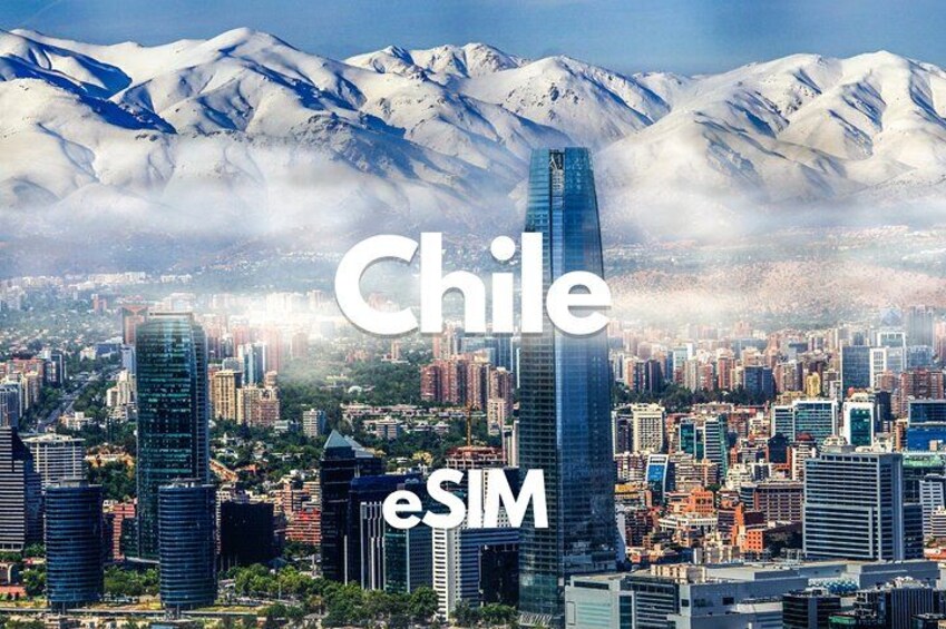 A cityscape with modern buildings and snow-capped mountains in the background. 1