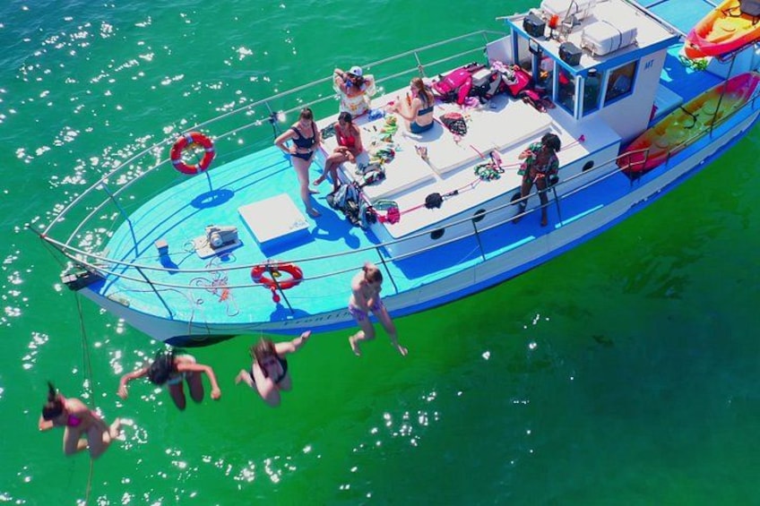Making a splash! ️ Jumping into fun from our classic 1957 wooden boat. 1