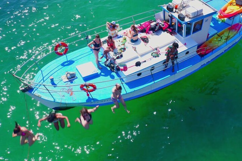 Making a splash! ️ Jumping into fun from our classic 1957 wooden boat. 1