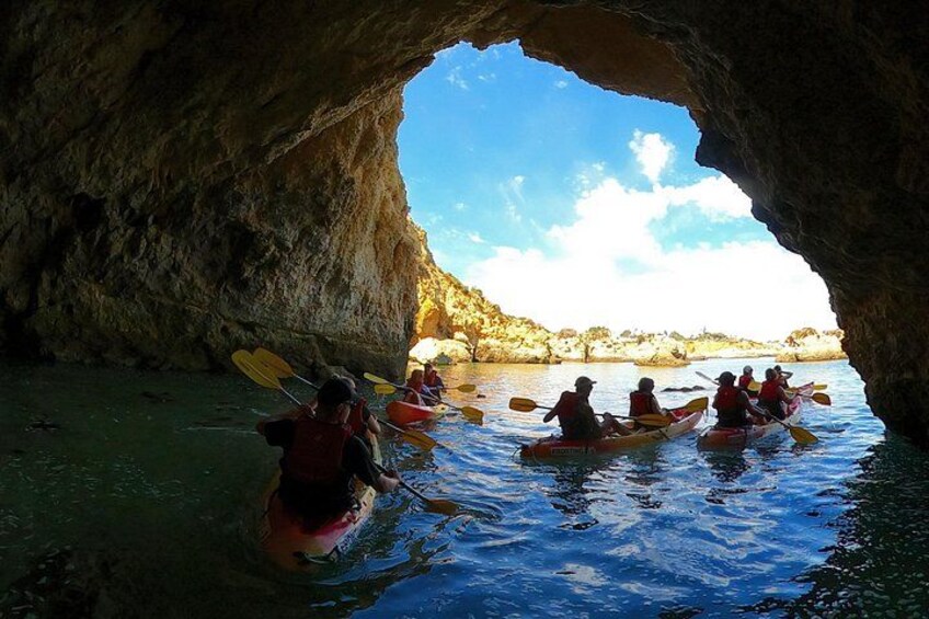 Paddling through Alvor’s secret cave, a hidden gem only accessible by kayak. 3