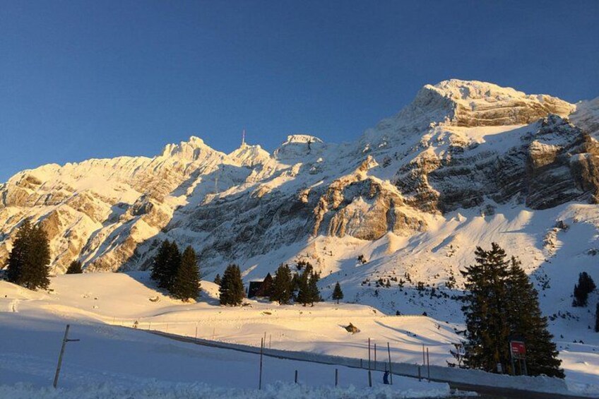 A snow-covered mountain range with clear skies. 3