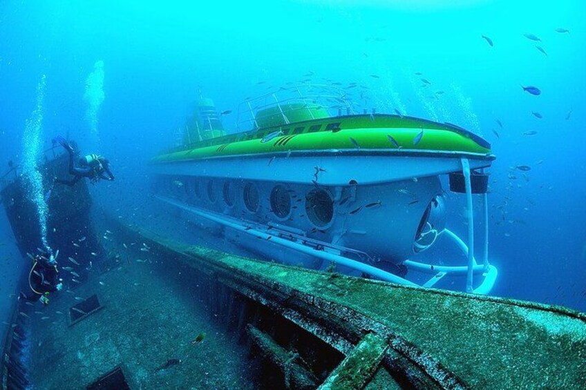 An underwater wreck with a diver. 1