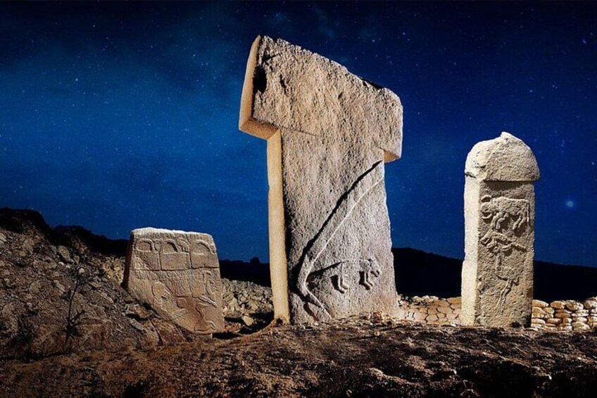 Ancient stone structures under a starry night sky. 4