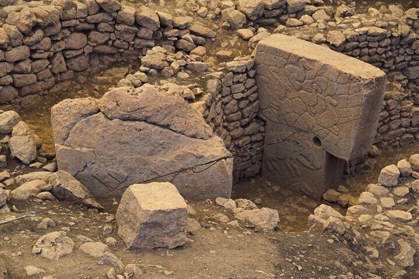 Ancient stone ruins with large boulders and walls. 5