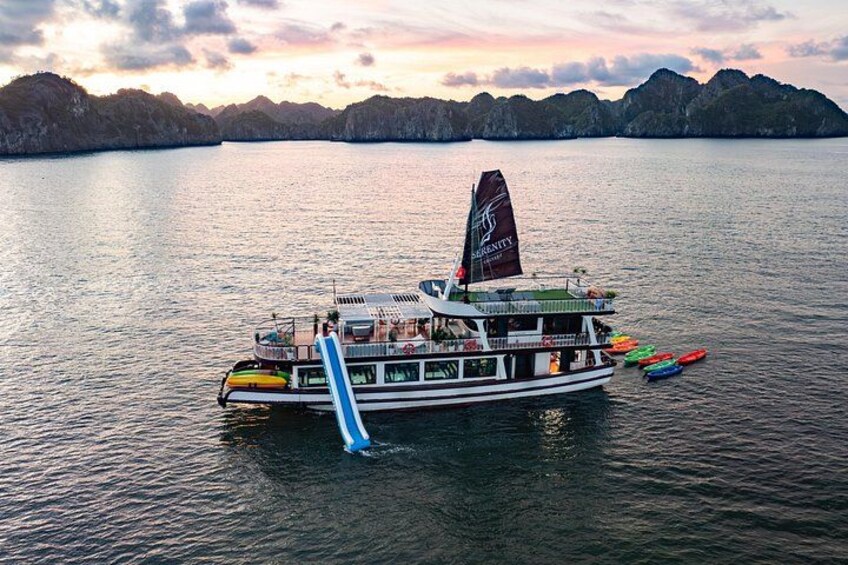 A boat with a flag, surrounded by calm water and distant mountains. 2