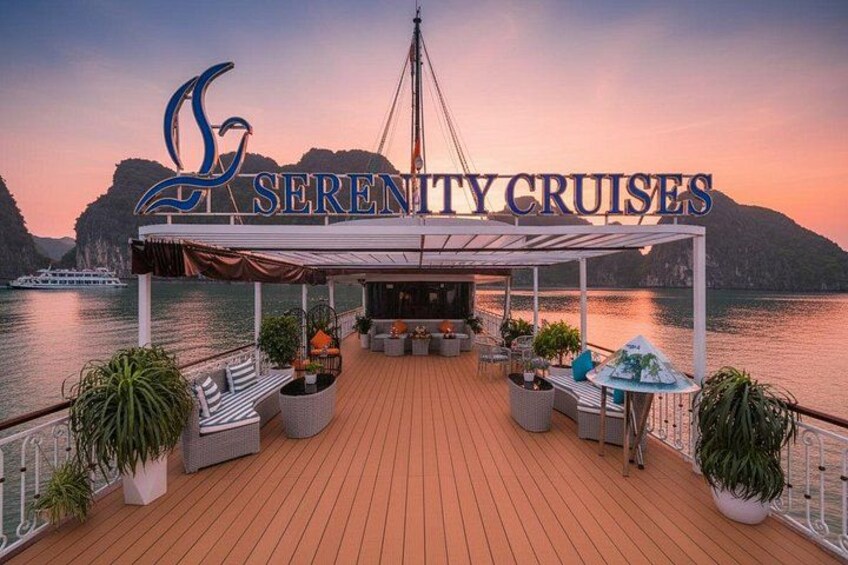 A deck with a canopy, seating, and potted plants. 3