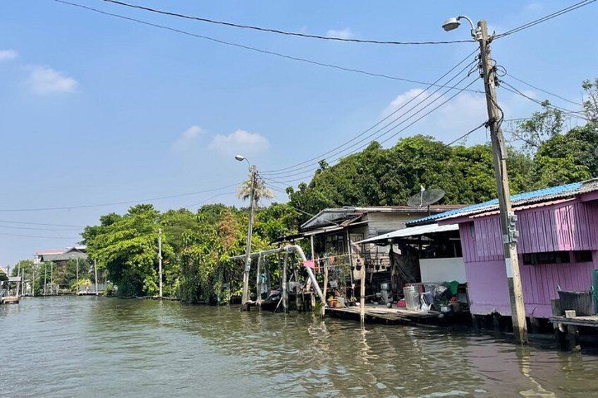 A boat trip through Bangkok’s canals, capturing the vibrant colors of longtail boats and the lush, jungle-like scenery that thrives within the heart of the city. 2