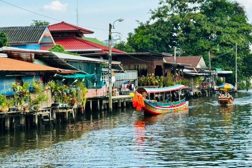 Let’s explore Bangkok’s canals, capturing the vibrant longtail boats and lush, jungle-like scenery. 3