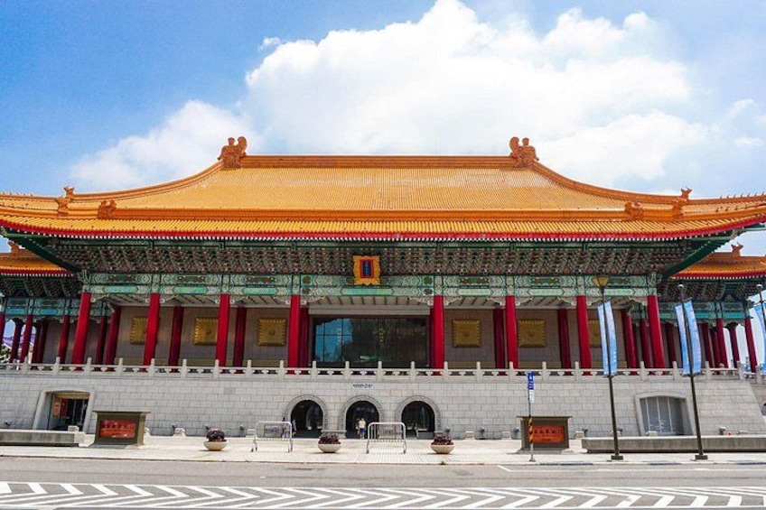 A traditional Chinese building with a golden roof, red pillars, and a tiled base. 3
