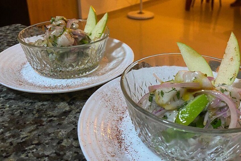 Two glass bowls of salad on a granite countertop. 5