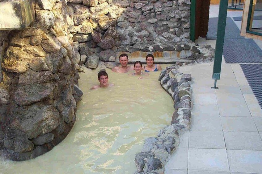 A hot spring with stone walls and a tiled floor. 3