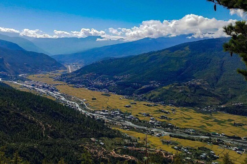 A mountainous landscape with a river, roads, and scattered buildings. 4