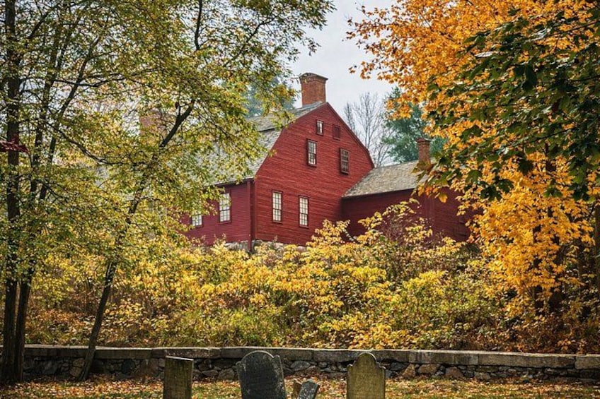 A red house surrounded by autumn foliage. 5