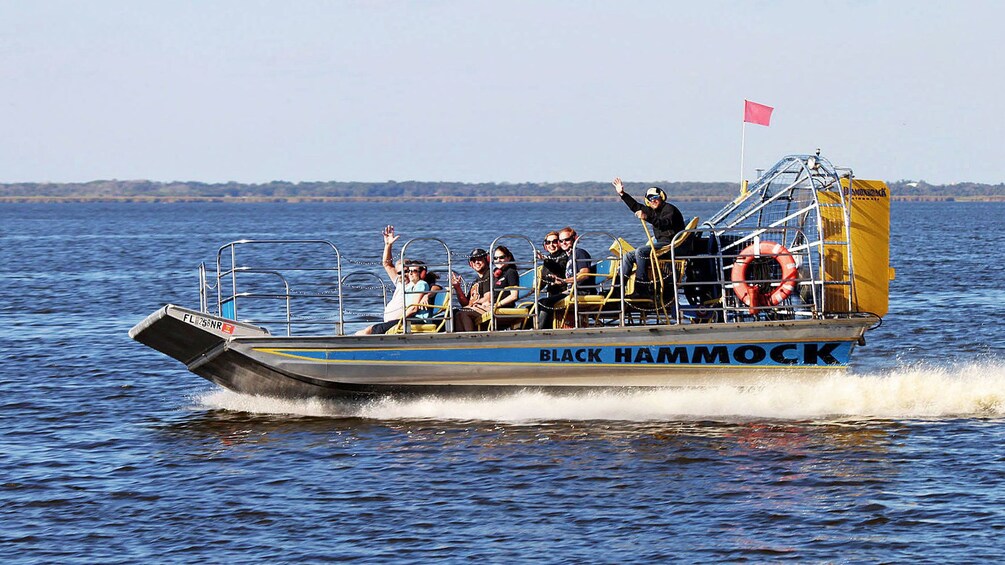 A boat named BLACK HAMMOCK on water. 1