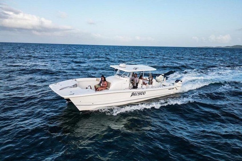 A white boat named 'BULLWOOD' on the water. 3