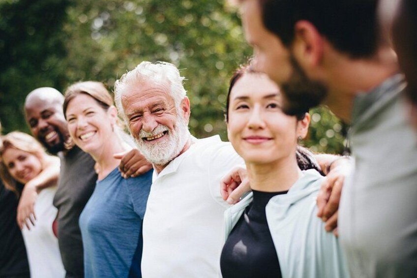 A group of people standing outdoors, possibly engaged in a social or group activity. 1