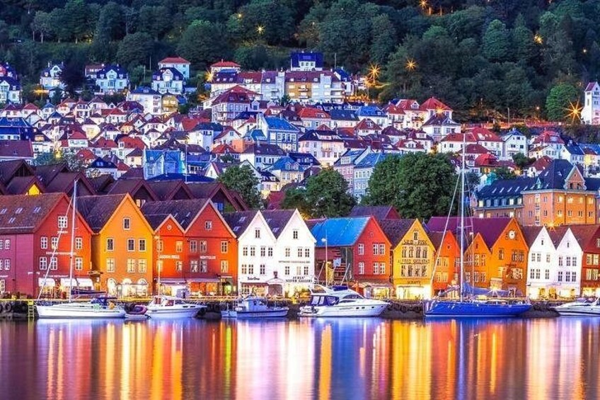 A waterfront town with colorful houses and boats docked along the shore. 5