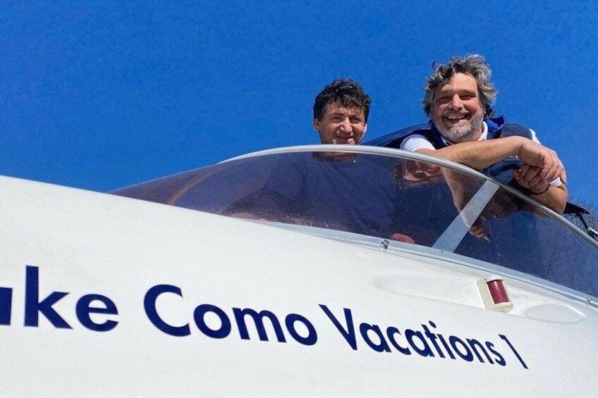 A small aircraft with the text 'Take Como Vacations' on its side. 1