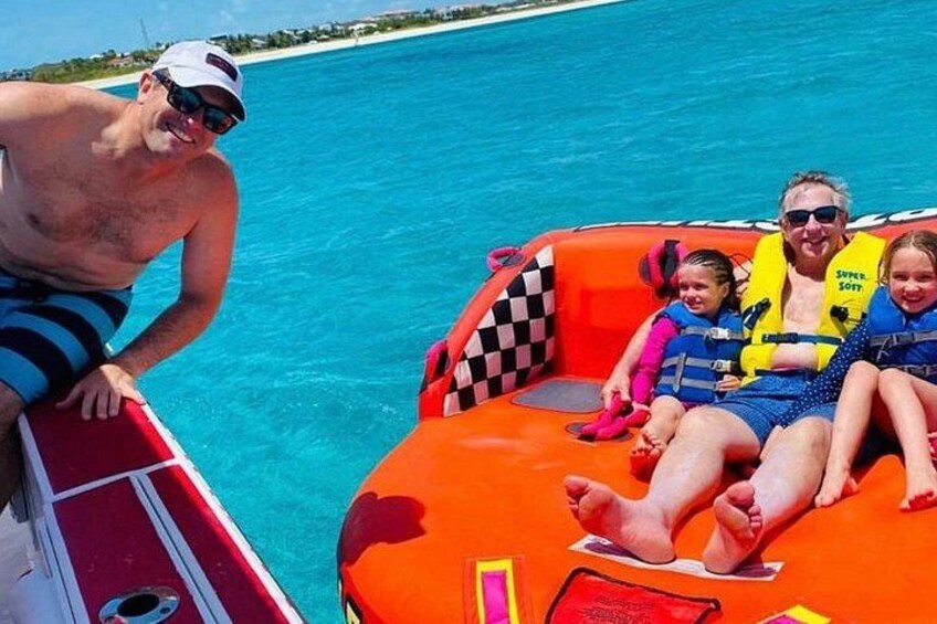 Tubing on grace bay beach Turks and caicos islands 3