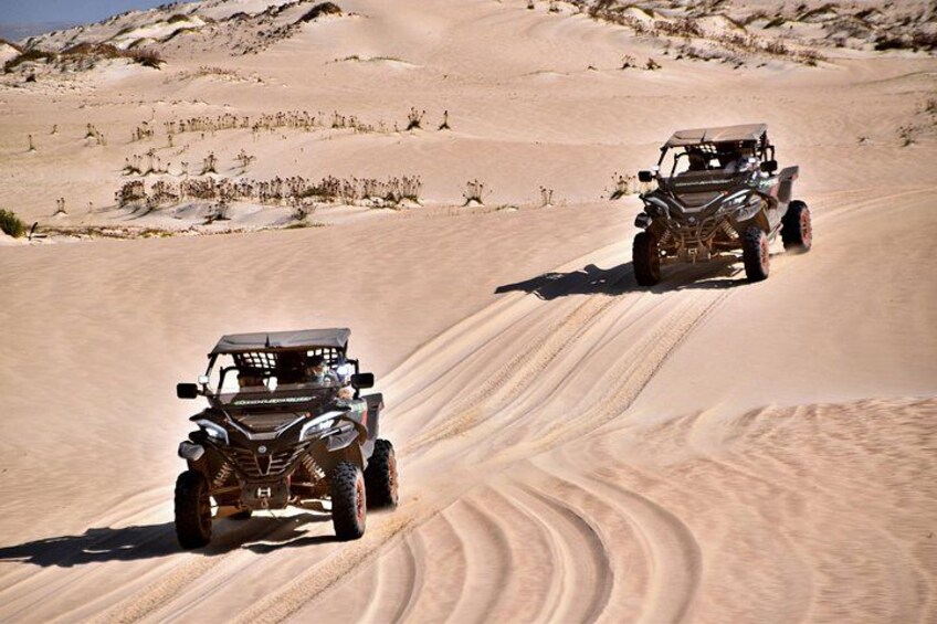Two off-road vehicles on a sandy dune. 5