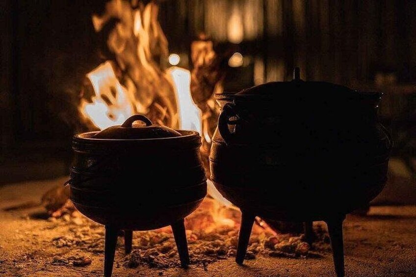Two pots near a fire. 2