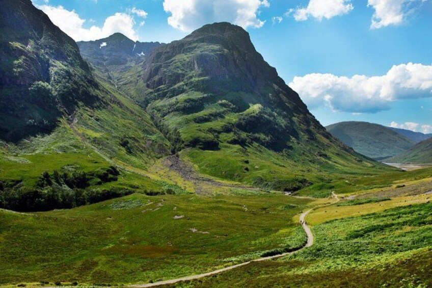 A mountainous landscape with a winding path. 2