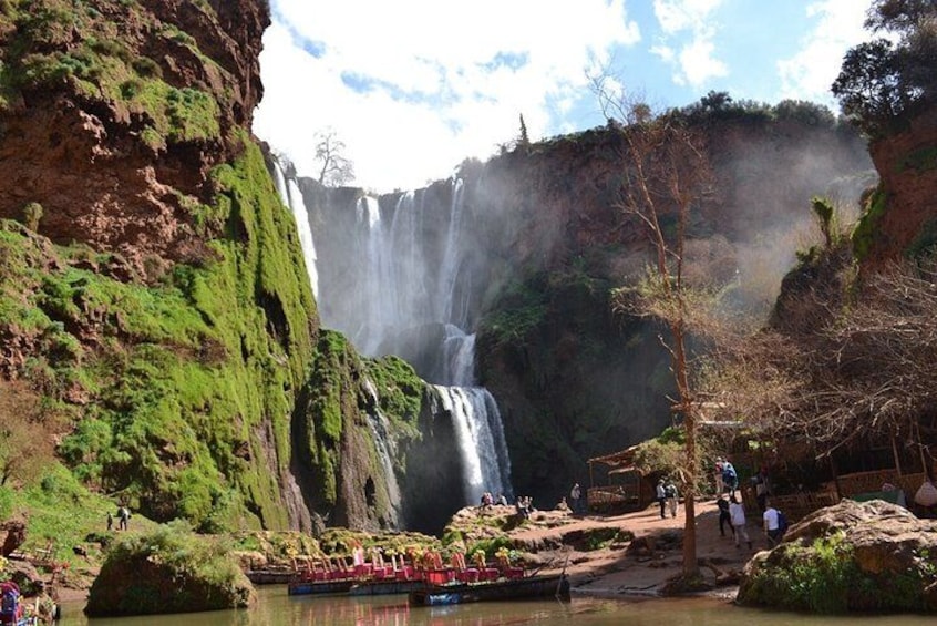 A waterfall, lush greenery, and a river. 2
