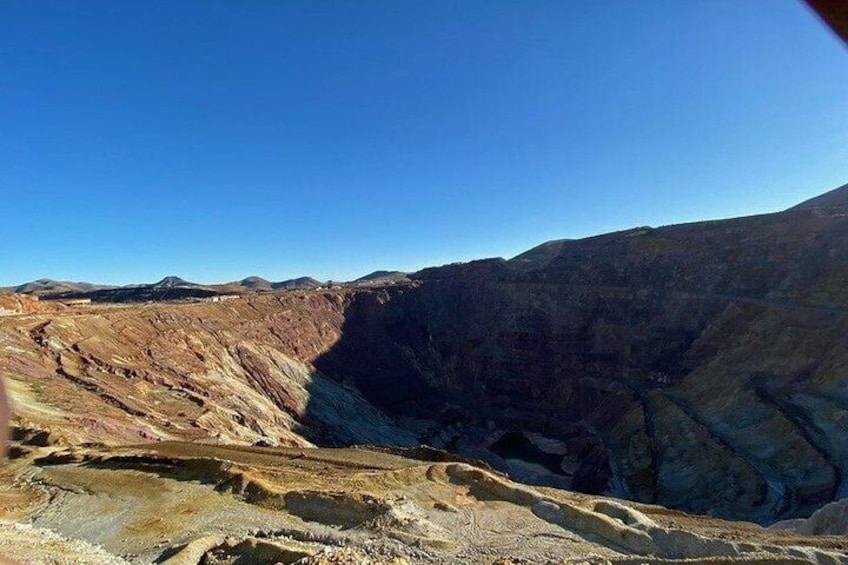 A rugged mountainous landscape with a deep canyon. 1