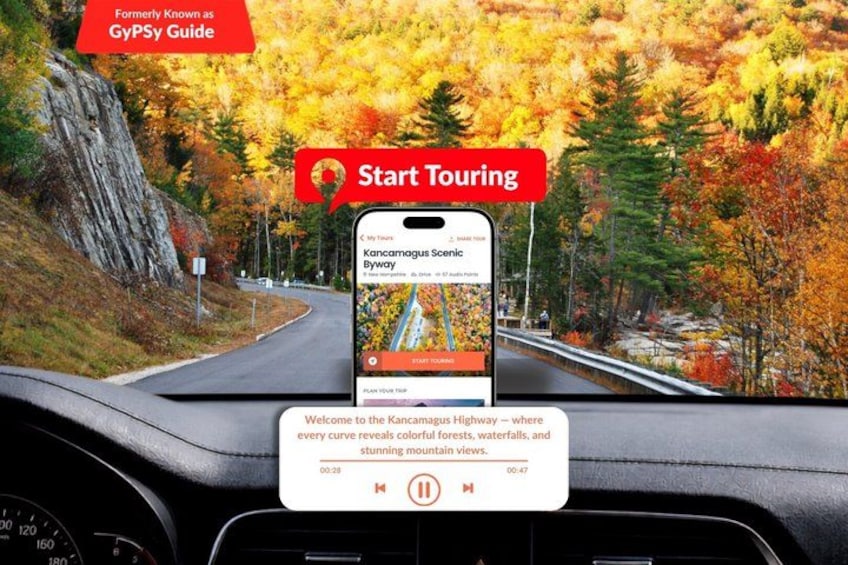 Un teléfono inteligente sujeto al tablero de un coche mostrando una ruta panorámica en un mapa. 1