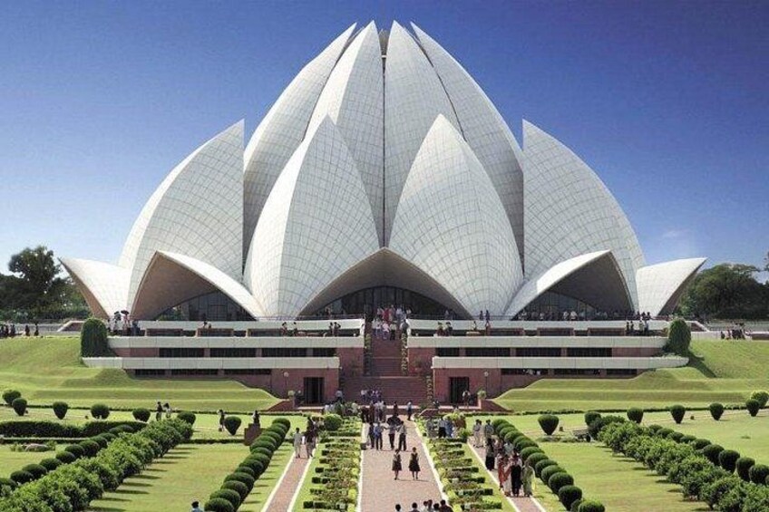 A large white lotus-shaped building with a central dome and multiple tiers. 5