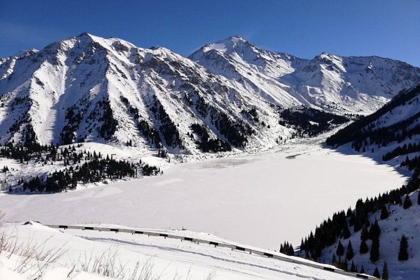 A snow-covered mountain landscape with a clear sky. 3