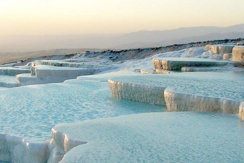 Terraced mineral pools in a natural landscape. 2