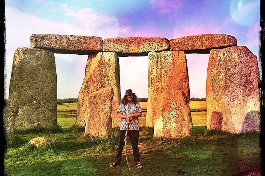 Stonehenge with a person standing in front of it. 4
