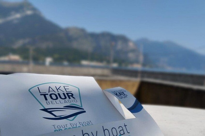 A paper with a logo and text for a Lake Tour by boat. 2