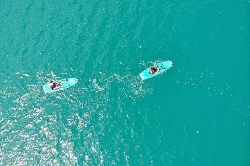 Two kayaks on turquoise water. 1