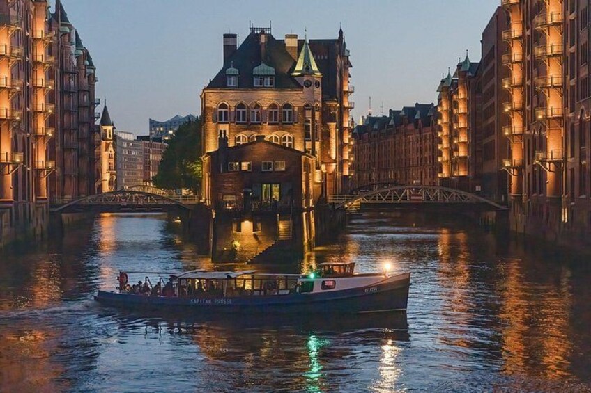 A boat on a river with a bridge in the background. 4