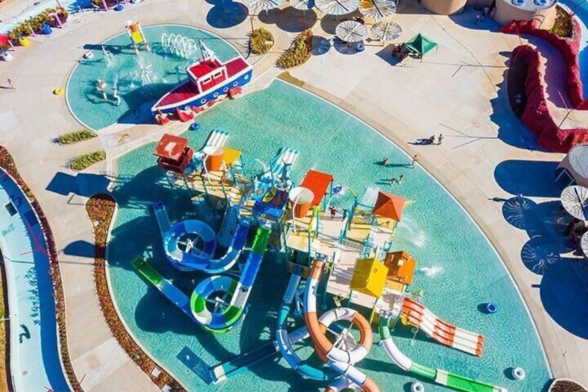 A water park with slides, pools, and a ship-shaped play structure. 1