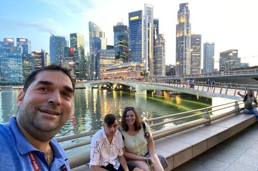 A city skyline with modern skyscrapers, a river, and a bridge. 2