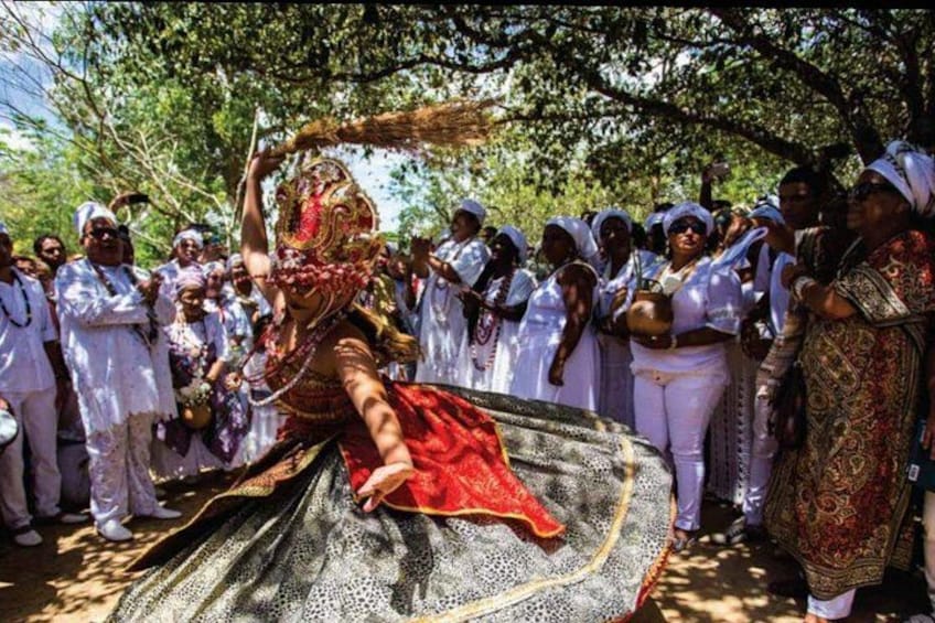 A person in traditional attire performing a dance. 1
