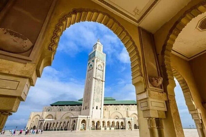 A historic building with arches and a tall tower. 4