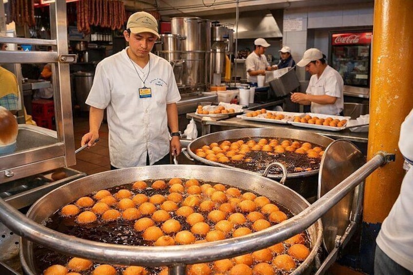 Enjoying traditional Colombian dishes in local markets and street stalls. This are buñuelos! 3