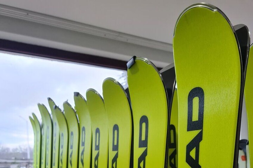 A row of bright yellow seats with black lettering. 3