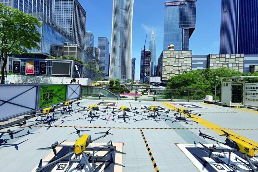 A cityscape with modern skyscrapers, a construction site with yellow barriers, and a clear blue sky. 4