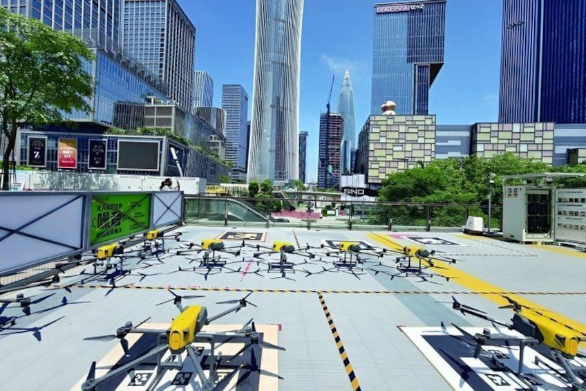 A cityscape with modern skyscrapers, a construction site with yellow barriers, and a clear blue sky. 5